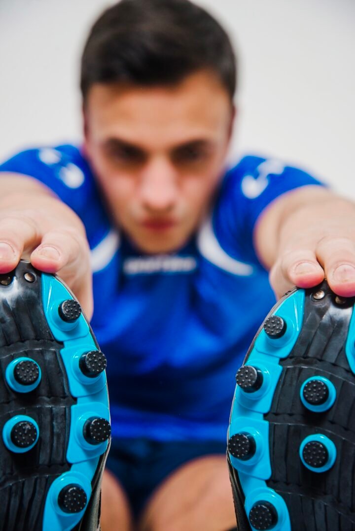 athlete-stretching-legs